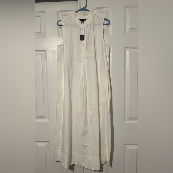 Brand new dress has never been worn, can use a nice wash to brighten it up. - Picture 6 of 7